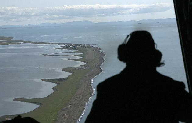 The coast near the village of Kivalina, Alaska. Ships in the upper right wait to be loaded from the Red Dog copper mine. (Al Grillo/AP)