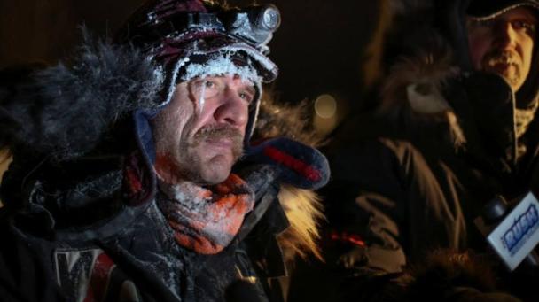 Musher Allen Moore was the first to cross the finish line at Takhini Hot Springs early Monday morning making him the 2014 Yukon Quest winner. (Mark Gillett/Yukon Quest)