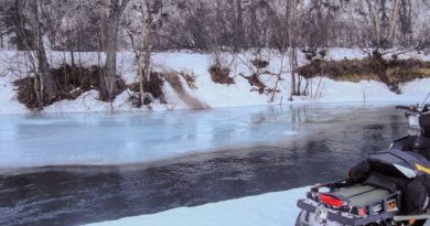 The Happy River portion of the Iditarod Trail was open in early February. The trail is visible on the far side of the bank, a dirty path up the bank. (Courtesy Howard Sevey / Alaska Dispatch)