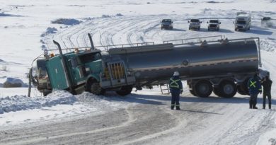 One of the two trucks carrying a mix of water, chemicals and sand used at ConocoPhillips' N.W.T. fracking project that slid off the Sahtu winter road over the past week. (courtesy of Roger Odgaard/Facebook/CBC.ca)