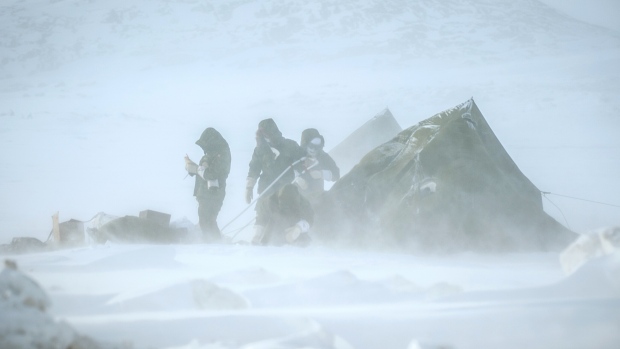 Soldiers prepare for a possible displacement during the exercise Guerrier Nordique as a blizzard develops in Iqaluit on March 3. Nearly 160 reservists from the 35th Canadian Brigade Group and the United States Army and the Vermont Army National Guard are training in the area from March 1-9. (Cpl. Valerie Villeneuve)