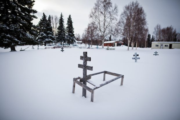 A gravesite outside the St. Nicholas Orthodox Church in Nikolai. (Loren Holmes / Alaska Dispatch)