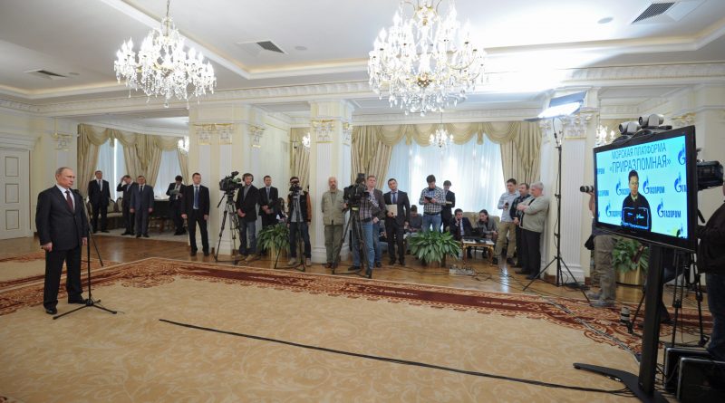 Russian President Vladimir Putin, left, speaks with Gazprom Head Alexei Miller as he attends a video call with the Prirazlomnaya arctic oil platform marking the launch of production in the Novo-Ogaryovo residence outside Moscow, Russia, Friday, April 18, 2014. (Alexei Druzhinin / RIA-Novosti / Presidential Press Service / AP )