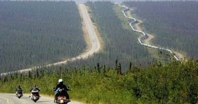 A group of motorcyclists drive up the Dalton Highway near the Arctic Circle in Alaska, Aug. 10, 2005. The highway stretches more than 400 miles to Deadhorse, a Prudhoe Bay industrial camp just south of the Arctic Ocean. (Al Grillo/AP)