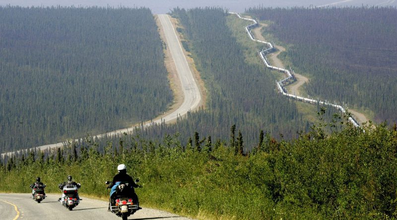 A group of motorcyclists drive up the Dalton Highway near the Arctic Circle in Alaska, Aug. 10, 2005. The highway stretches more than 400 miles to Deadhorse, a Prudhoe Bay industrial camp just south of the Arctic Ocean. (Al Grillo/AP)