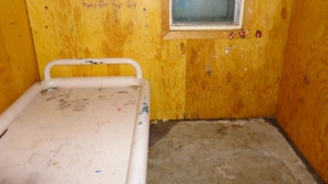Plywood walls at the overcrowded Baffin Correctional Centre are a fire hazard, among many problems with the outdated facility. (Office of the Correctional Investigator)