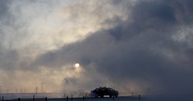 A truck moves along a road near BP's North Slope facilities at Prudhoe Bay, Alaska in 2007. (Photo by Bob Fila/Chicago Tribune/MCT via Getty Images)