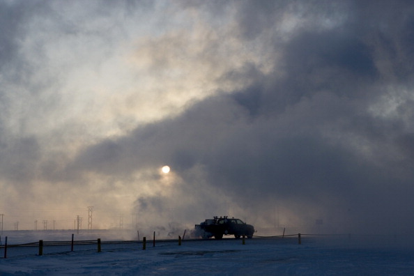 A truck moves along a road near BP's North Slope facilities at Prudhoe Bay, Alaska in 2007. (Photo by Bob Fila/Chicago Tribune/MCT via Getty Images)