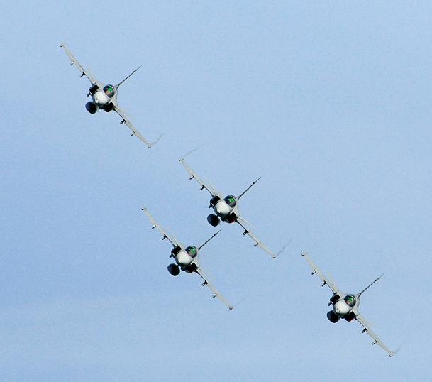 Pilots flying four JAS 39 Gripen jet fighters perform during the Day of the Airforce in Linkoping, Sweden on June 13, 2010. (AFP)