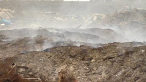 A close-up view of Iqaluit's dump fire on June 26, 2014. The fire has been burning since May 20, forcing schools to close and even smoking out a planned city cleanup. The city is now considering options for putting it out, but the cost is daunting. ( Jane Sponagle-CBC )