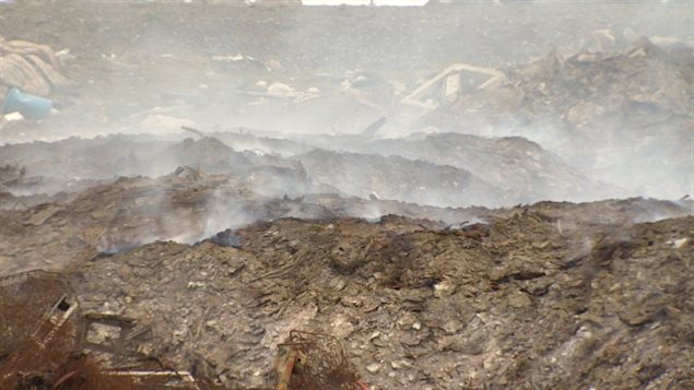 A close-up view of Iqaluit's dump fire on June 26, 2014. The fire has been burning since May 20, forcing schools to close and even smoking out a planned city cleanup. The city is now considering options for putting it out, but the cost is daunting. ( Jane Sponagle-CBC )
