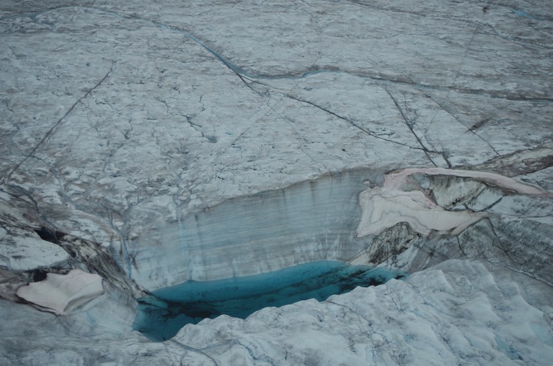 A moulin in a supraglacial lake on the Greenland Ice Sheet. (Mia Bennett / August 2014)