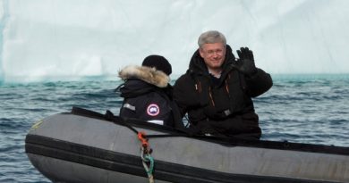 Prime Minister Stephen Harper and his wife, Laureen, take a closer look at an iceberg in a Zodiac inflatable boat Sunday west of Pond Inlet on Eclipse Sound. Harper wrapped up his annual trip to Canada's North this week. (Adrian Wyld/The Canadian Press)