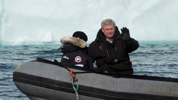 Prime Minister Stephen Harper and his wife, Laureen, take a closer look at an iceberg in a Zodiac inflatable boat Sunday west of Pond Inlet on Eclipse Sound. Harper wrapped up his annual trip to Canada's North this week. (Adrian Wyld/The Canadian Press)