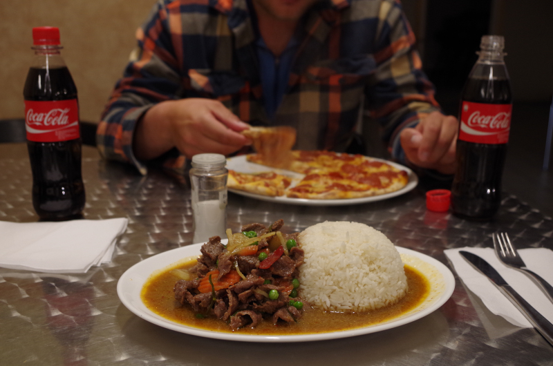 Greenland in a nutshell: Muskox red curry, a pepperoni pizza, and Coca-Cola bottled in Nuuk. (Mia Bennett/ August 2014)