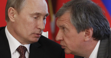 Russian President Vladimir Putin, left, and CEO of state-controlled Russian oil company Rosneft Igor Sechin, at a signing ceremony in 2013. (Maxim Shemetov/ AP)