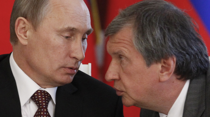 Russian President Vladimir Putin, left, and CEO of state-controlled Russian oil company Rosneft Igor Sechin, at a signing ceremony in 2013. (Maxim Shemetov/ AP)