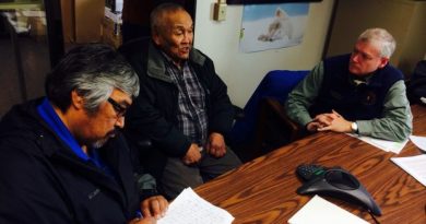 Musher and sobriety activist Mike Williams, left, elder John Phillip and Lt. Gov. Mead Treadwell in Bethel at a town hall meeting on the marijuana legalization initiative on Sept. 29, 2014. (Lisa Demer / Alaska Dispatch News)