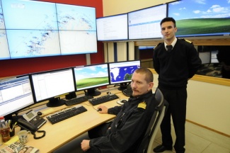 Based in Vardø on the coast of the Barents Sea, Ståle Sveinungsen (right) keeps control of all vessel traffic along the coast of Norway. (Thomas Nilsen / Barents Observer)