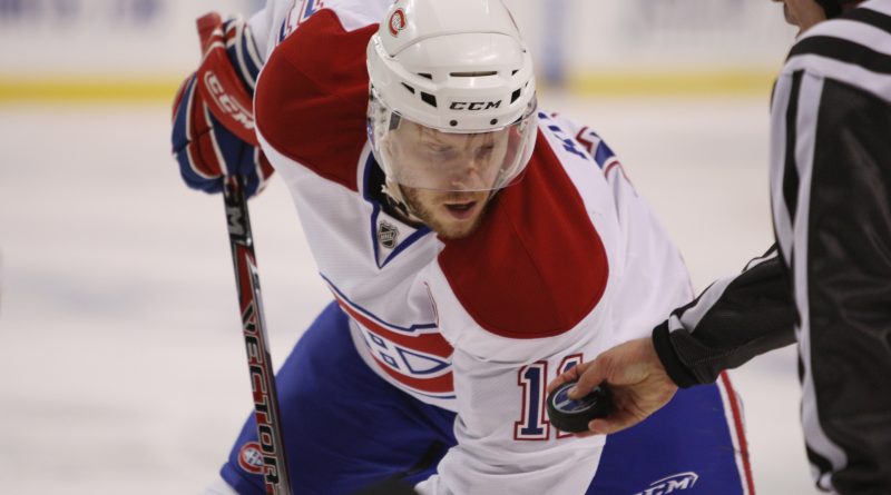 Saku Koivu in his Montreal Canadiens uniform during a face-off against the Boston Bruins during game six of the 2008 NHL Stanley Cup Playoffs Eastern Conference Quarterfinals series in 2008. (Getty Images)