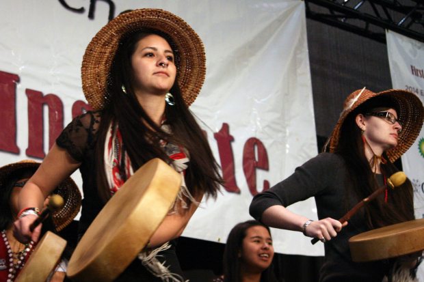 Jill Kaasteen Meserve, 23, of Juneau, performs with the Woosh.ji.een Dance and Drum Group at the First Alaskans Institute Elders and Youth Conference on Wednesday. Meserve said she supported a bill passed this year recognizing 20 Alaska Native languages as official state languages. (Lisa Demer / Alaska Dispatch News)