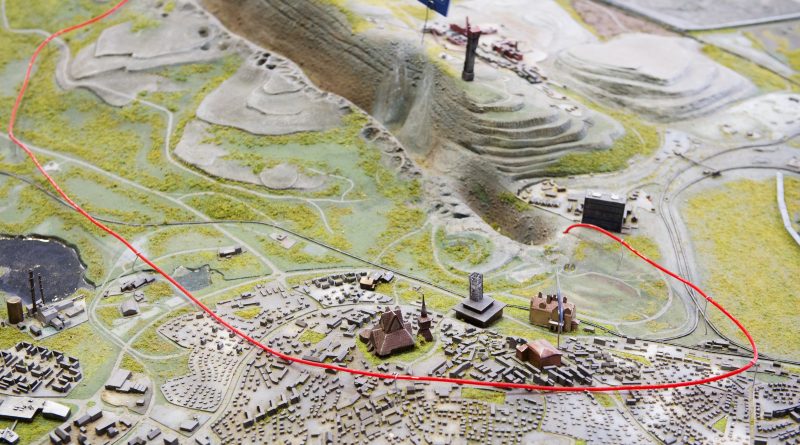 This picture shows a red wire on a model of Sweden's northernmost town of Kiruna that marks the area of the town which will be moved few kilometers away to save it from sinking into the ground due to underground cracks created by iron ore mining. (Jonathan Nackstrand/AFP/Getty Images)