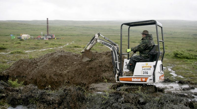 A worker with the Pebble Mine project test drills in the Bristol Bay region of Alaska near the village of Iliamma, Alaska in July 13, 2007. An EPA report at the time indicated a large-scale copper and gold mine in Alaska's Bristol Bay region could have devastating effects on the world's largest sockeye salmon fishery and adversely affect Alaska Natives, whose culture is built around salmon.(Al Grillo/AP)