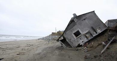 A home in Shishmaref, Alaska in 2006. Temperatures that have risen 15F (4.4C) over the last 30 years are causing a reduction in sea ice, thawing of permafrost along the coast, making the shoreline vulnerable to erosion. (Gabriel Bouys/AFP/Getty Images)