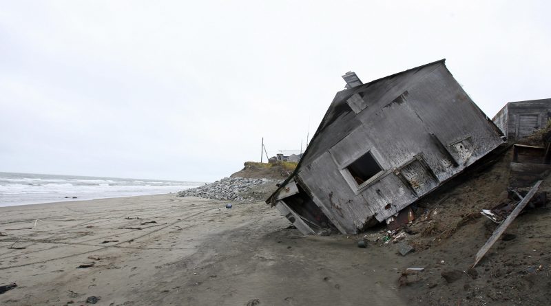 A home in Shishmaref, Alaska in 2006. Temperatures that have risen 15F (4.4C) over the last 30 years are causing a reduction in sea ice, thawing of permafrost along the coast, making the shoreline vulnerable to erosion. (Gabriel Bouys/AFP/Getty Images)