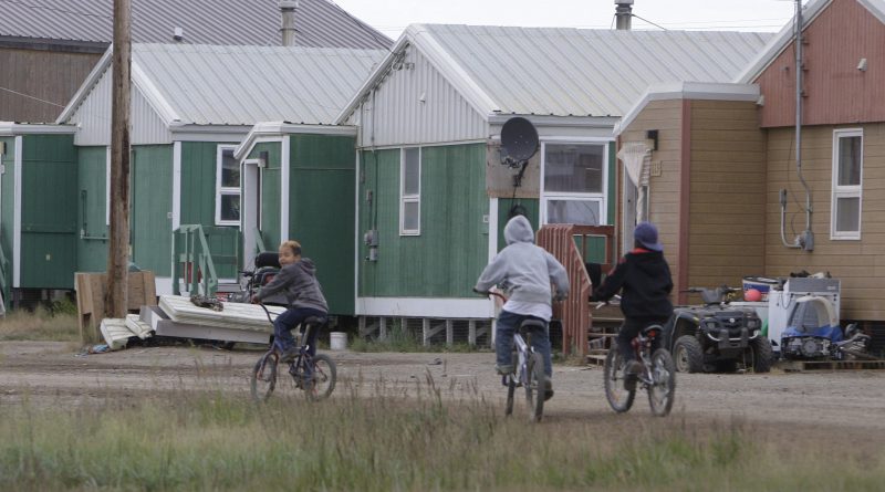 Tuktoyaktuk (pictured above) in Canada's Northwest Territories. Rising seas from global warming and land sinking as permafrost thaws are threatening the Arctic community. A recent study suggests governments need policies to address climate migration from around the world. (Rick Bowmer/AP)