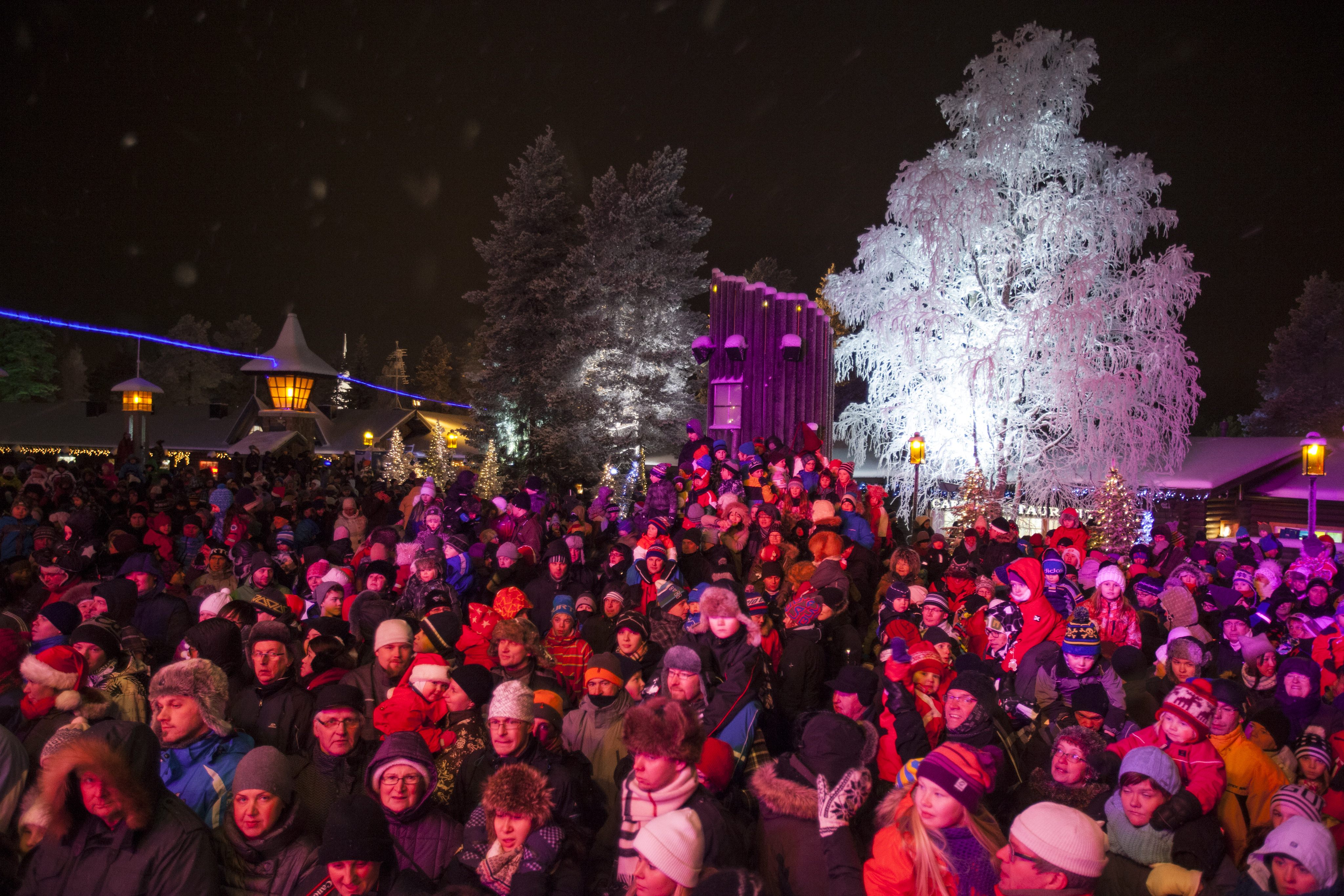 Children and adults watch Santa Claus getting ready to start the long journey to children all over the world, one day before Christmas Eve at the Arctic Circle in Rovaniemi, Finland in 2012. (Kaisa Siren/AFP/Getty Images)