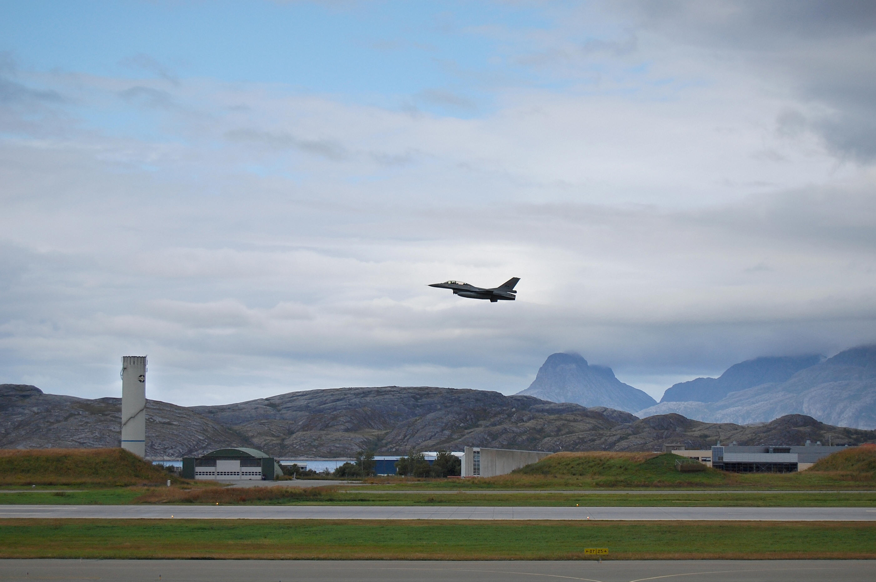 A Norwegian F16 in the air at the aircraft base in Bodoe, northern Norway on August 21, 2008. At the base, situated above the Arctic Circle, two F16s are permanently mobilized ready to scramble within 15 minutes to encounter a potential threat. (Pierre-Henry Deshayes/AFP/Getty Images)
