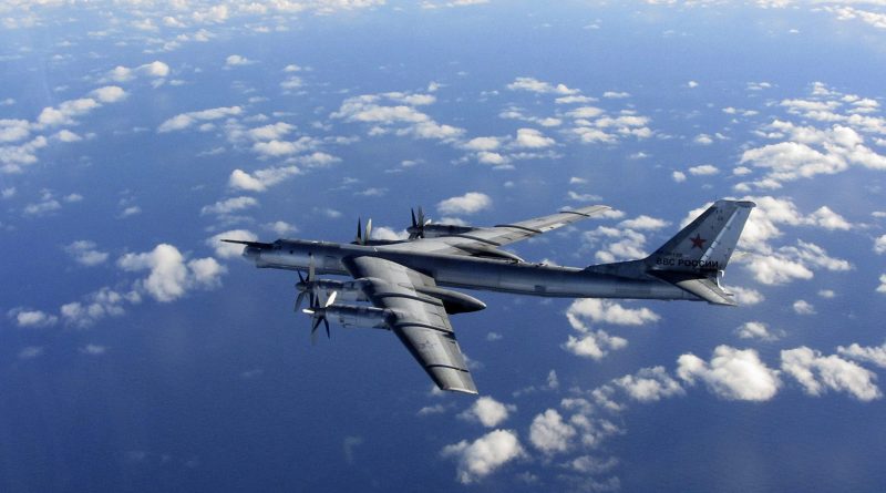 This is a Wednesday, Oct. 29, 2014 file photo provided by Britain's Royal Air Force of a Russian military long range bomber aircraft photographed by an intercepting RAF quick reaction Typhoon (QRA) as it flies in international airspace. (Royal AIr Force/AP)
