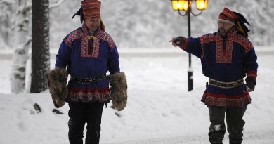 To men in traditional Sami dress in Arctic Finland. A new smart phone app provides a Sami character keyboard. (Olivier Morin/AFP/Getty Images)