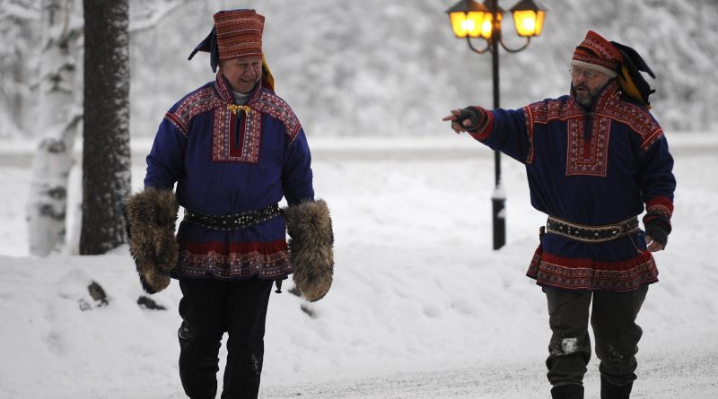 To men in traditional Sami dress in Arctic Finland. A new smart phone app provides a Sami character keyboard. (Olivier Morin/AFP/Getty Images)