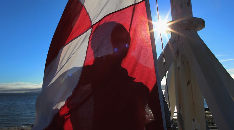 The Greenlandic flag in territory's capital city of Nuuk. The incumbent Siumut party narrowly won a snap election in November 2014. (Joe Raedle/Getty Images)