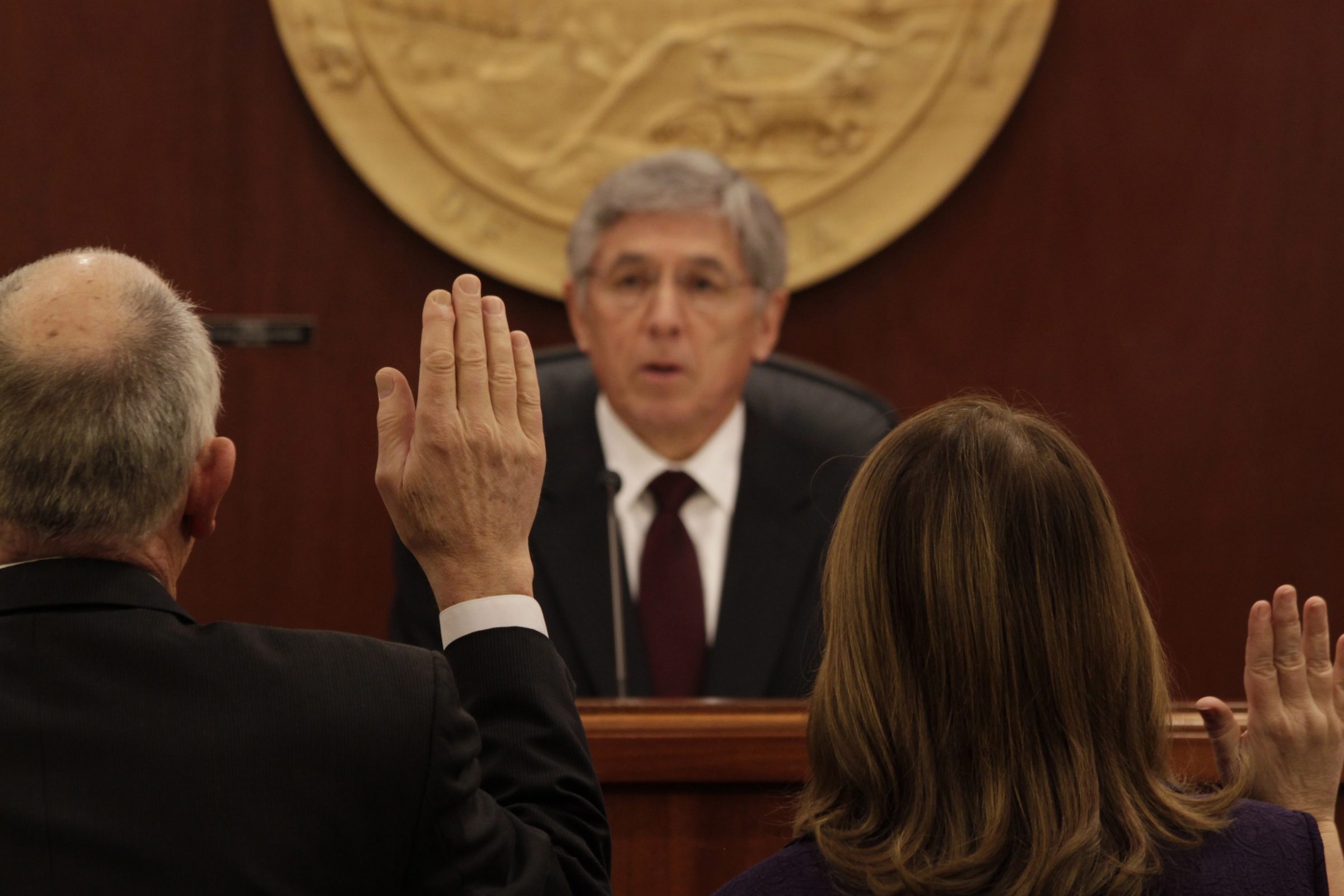 Lt. Gov. Byron Mallott issues the oath of office to members of the Alaska House of Representatives on Tuesday, Jan. 20, 2015 during the opening of the 29th Alaska Legislature. (James Brooks/Juneau Empire/AP Photo)