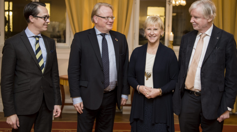(L-R) Finland's Defence Minister Carl Haglund, Sweden's counterpart Peter Hultqvist, Swedish Foreign Minister Margot Wallstrom and Finnish counterpart Erkki Tuomioja pose for a photo upon arrival for a dinner at the government headquarters Rosenbad, in Stockholm, Sweden, on November 10, 2014. (Pontus Lundahl/AFP/Getty Images)