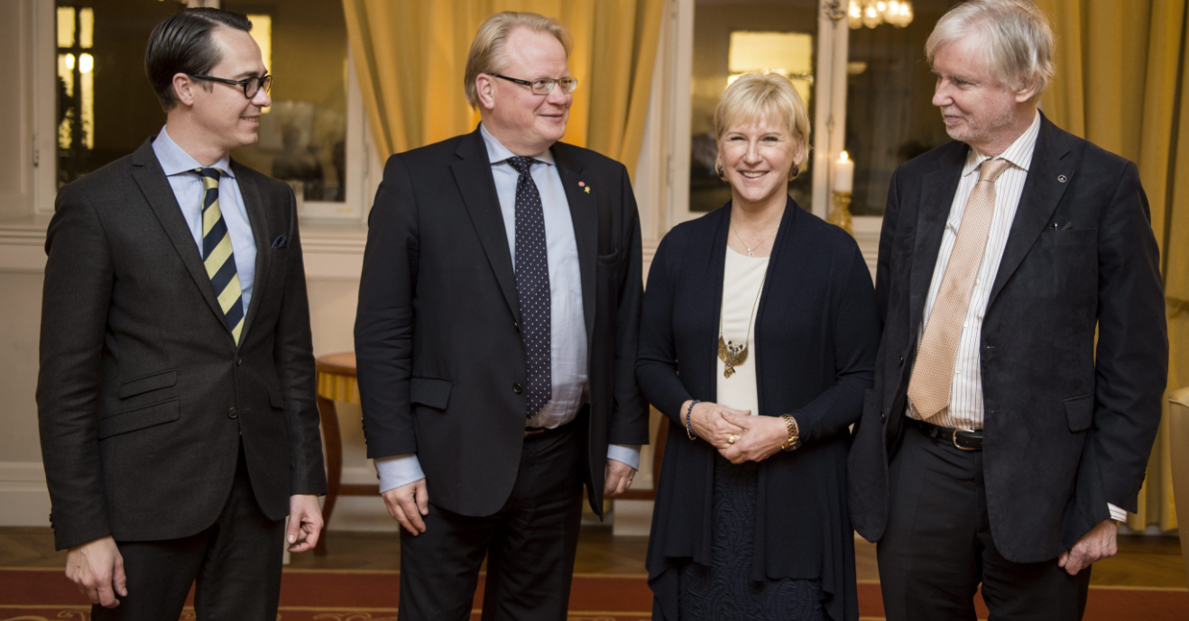 (L-R) Finland's Defence Minister Carl Haglund, Sweden's counterpart Peter Hultqvist, Swedish Foreign Minister Margot Wallstrom and Finnish counterpart Erkki Tuomioja pose for a photo upon arrival for a dinner at the government headquarters Rosenbad, in Stockholm, Sweden, on November 10, 2014. (Pontus Lundahl/AFP/Getty Images)