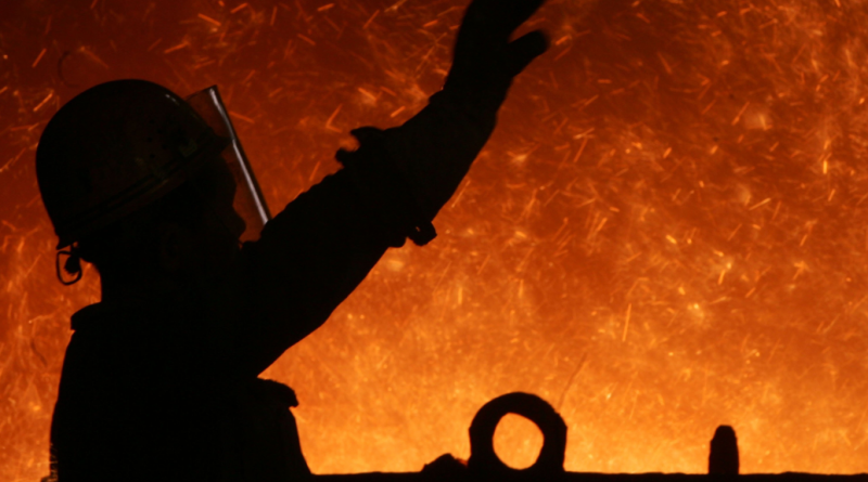 A worker in front of a blast furnace at an iron and steel factory in China. (China Photos/Getty Images)