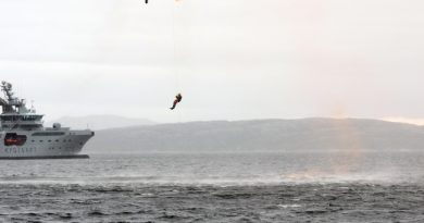 Exercise Barents includes search and rescue operations. Photo shows "KV Harstad" and a Norwegian rescue helicopter involved in a similar exercise in 2013. (Jonas Karlsbakk/Barents Observer)