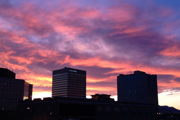 (A sunrise over downtown Anchorage on Thursday morning, Nov. 13, 2014, as seen from the top of the Hotel Captain Cook parking garage. Erik Hill / ADN)