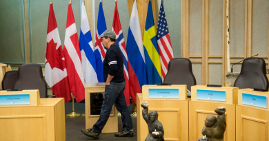 Flags from participating nations are seen in the Nunavut Legislative Assembly in preparation for the Artic Council Ministerial Meeting Thursday, April 23, 2015 in Iqaluit, Nunavut. Ministers from the eight Arctic nations and the leaders of northern indigenous groups will met Friday in Iqaluit. (Paul Chiasson/The Canadian Press)