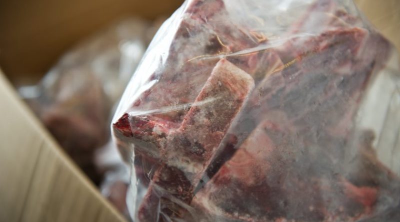 Greg Giannulis, owner of Mike's Quality meats in Eagle River, shows reindeer steaks he has frozen for sale. Giannulis has been purchasing and processing reindeer meat from Savoonga. (Marc Lester/ADN)