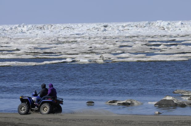 ATV riders travel the Chukchi Sea beach in Barrow on Monday, June 27, 2011. (Marc Lester / Alaska Dispatch News)