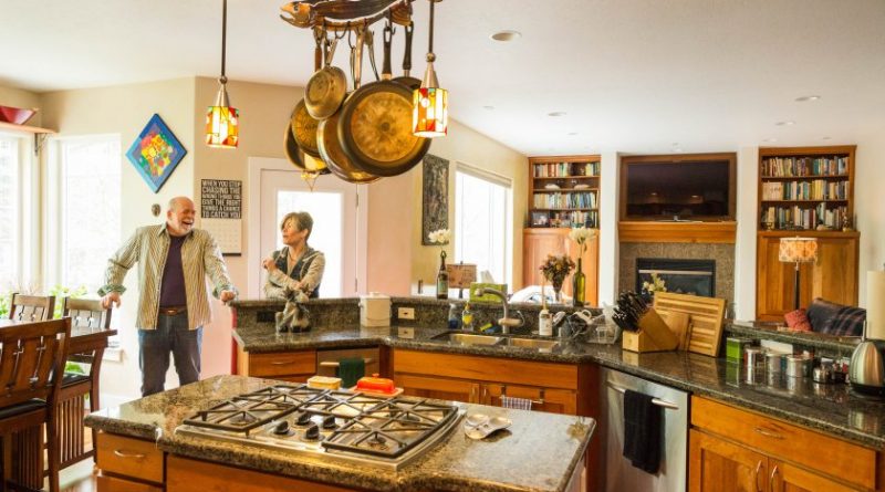Couple Ron Clarke and Kristine Kennedy in their west Anchorage home. (Loren Holmes / Alaska Dispatch News)