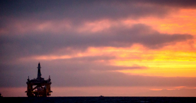 In this April 17, 2015 file photo, an oil drilling rig arrives aboard a transport ship at sunrise, following a journey across the Pacific in Port Angeles, Wash. Royal Dutch Shell hopes to use the rig for exploratory drilling during the summer open-water season in the Chukchi Sea off Alaska's northwest coast. (Daniella Beccaria/seattlepi.com via AP)