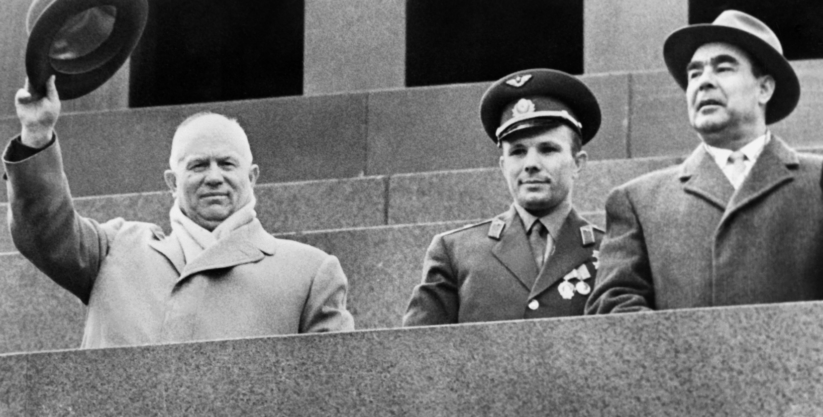Soviet Cosmonaut Yuri Gagarin (centre), Soviet leader Nikita Khrushchev (left) and Leonid Brezhnev (right) salute the crowd on May 1, 1961 during a gathering on Red Square to celebrate Gagarin's flight aboard Vostok I. Yuri Gagarin became the first human to travel in space aboard Vostok I and the first to orbit the Earth. For decades, the U.S. and the Soviet Union battled to outdo each other in space. Any echoes in today's Arctic? /AFP/GettyImages)