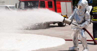 A firefighter in training with fire retardant foam. What effect does foam have on the environment? (iStock)