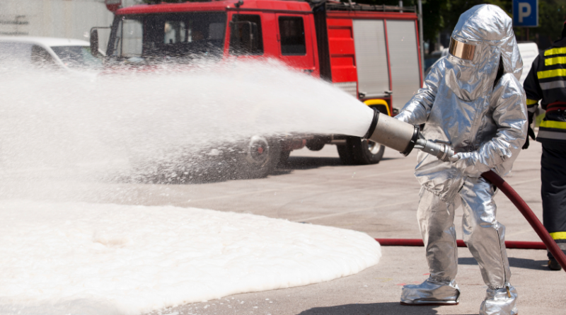 A firefighter in training with fire retardant foam. What effect does foam have on the environment? (iStock)